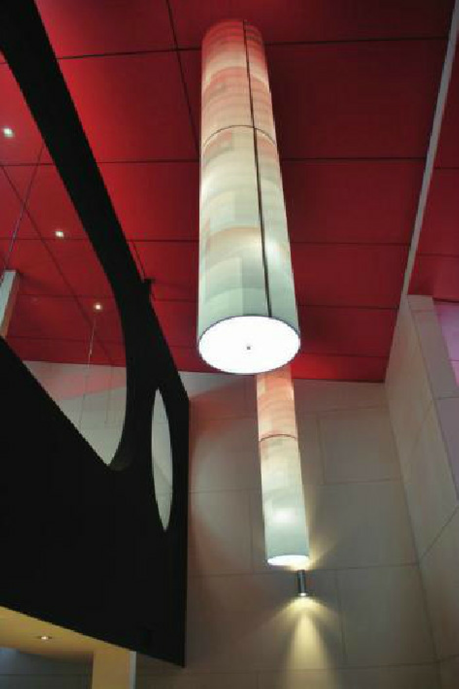 Bespoke Drum Light Cylinder Pendant suspended in a building void